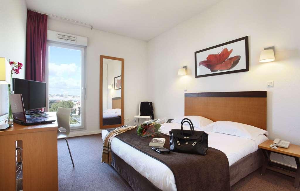 Appart'Hotel Odalys City - Bioparc Lyon Est Ruang foto